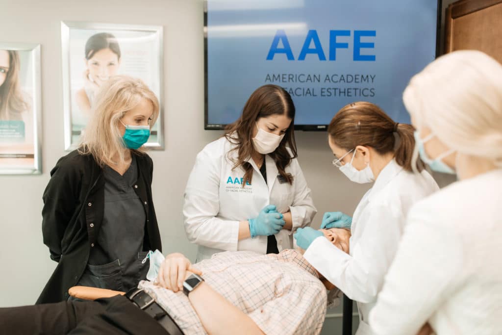 Students learning injectables at an AAFE course